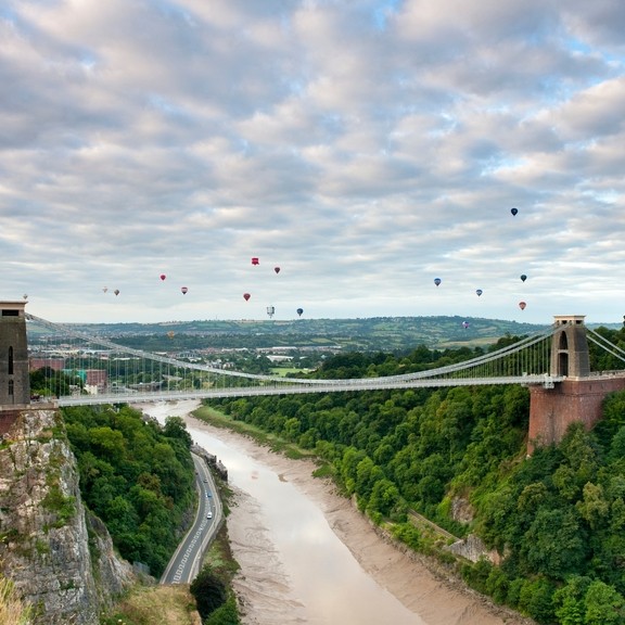 Hot air baloons floating above the Clifton Suspension Bridge in Bristol