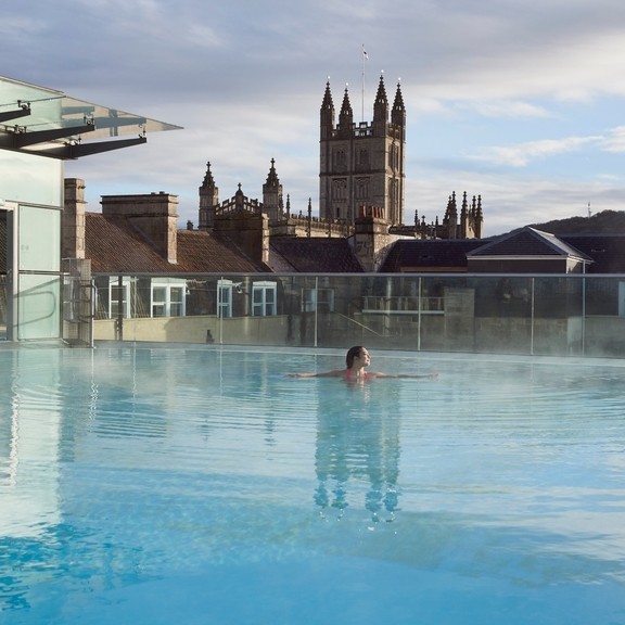 Woman in the swimming pool, Thermae Bath Spa, Bath, Somerset, England.