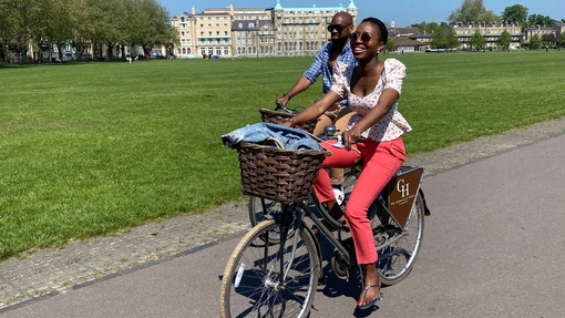 Woman and a man riding bicycles in a park
