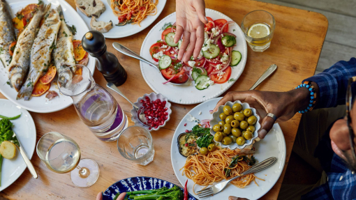 A group of people enjoy a meal at a table