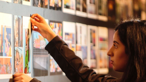 Woman arranging display in a museum