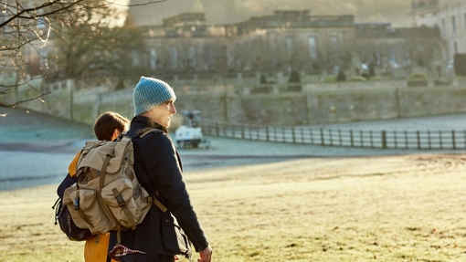 Couple walking in the grounds of a country house