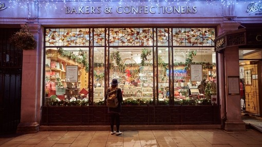 Woman window shopping at Christmas
