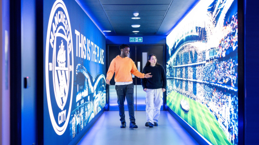 Two visitors on a stadium tour inside