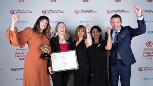 Photo of Gold Winners for Resilience and Innovation Award - Black Country Living Museum (Hannah Brown, Sukhi Baden, Carolyn Sankey, Vicki Stanley, Carol King) - in front of the branded photo backdrop