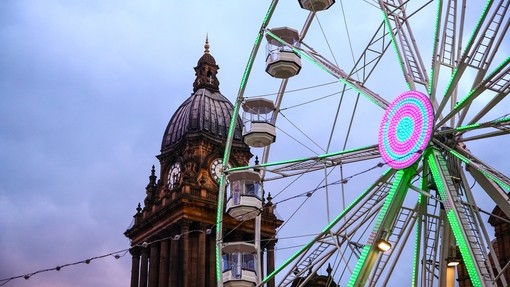 Looking up at Leeds Town Hall and The Observation Wheel at Dusk