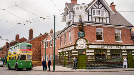 A pub and an old style bus set in a living museum.