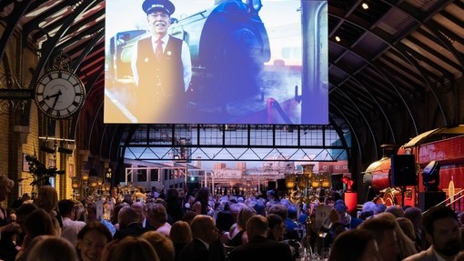 Photo of the Platform 9 ¾ set up with guests at the VisitEngland Awards for Excellence 2023. Warner Bros. Studio Tour - The Making of Harry Potter, Hertfordshire.