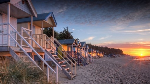 Beach huts on the beach at dusk