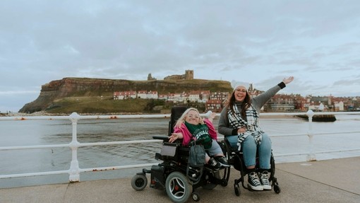 Jennie and Gem, two wheelchair users, on Whitby Pier.