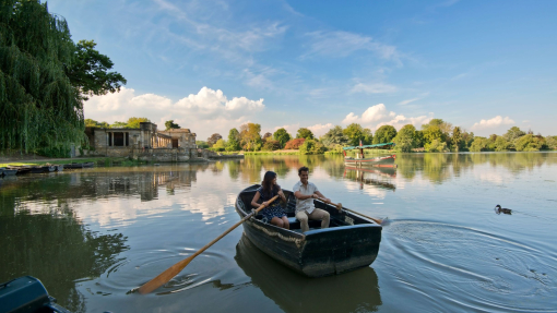 Man and woman in a rowing boat on a lake