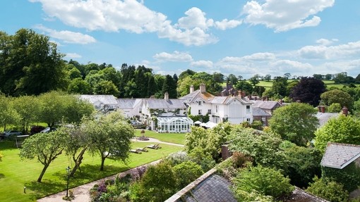 The view of the gardens and greenhouse at an upscale Country House Hotel & Restaurant