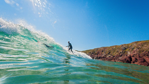 Surfer riding the waves
