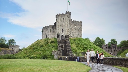 Family walking in front of Cardiff Castle.