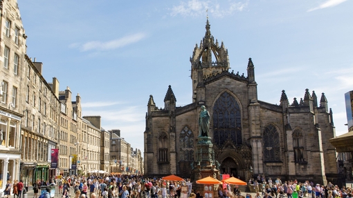 People walking in a city centre on a sunny day