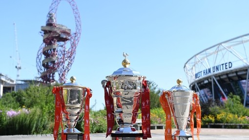 Three trophies from Rugby League World Cup placed on the ground in Queen Elizabeth Olympic Park