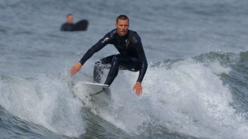 Surfer surfing a wave.