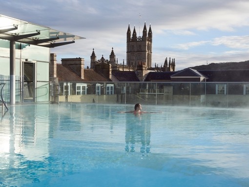 Woman in the swimming pool, Thermae Bath Spa, Bath, Somerset, England.