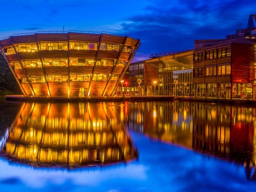View of a modern building on university campus during twilight