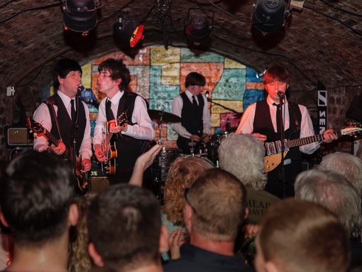 A tribute band playing in an underground nightclub.