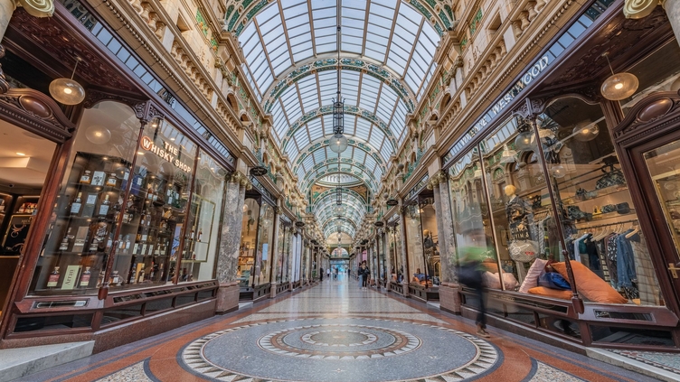 Looking through an ornate shopping arcade.