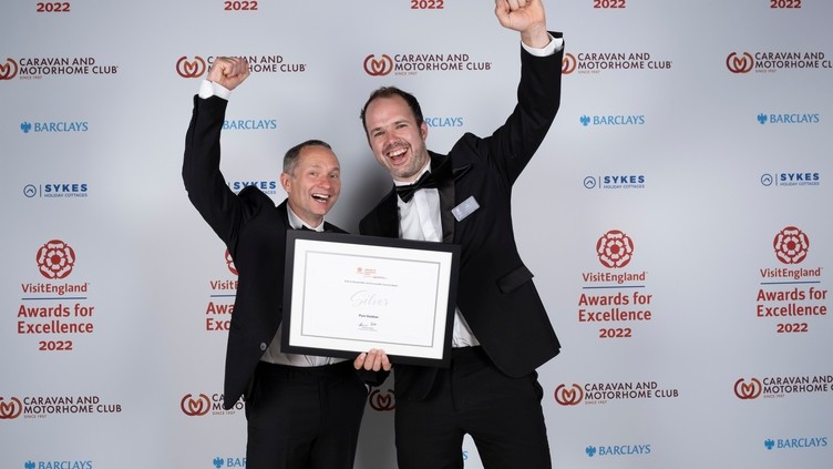 Photo of Silver Winners for Ethical, Responsible and Sustainable Tourism Award - Pure Outdoor (Gavin Moy, Guy Wilson) - in front of the branded photo backdrop