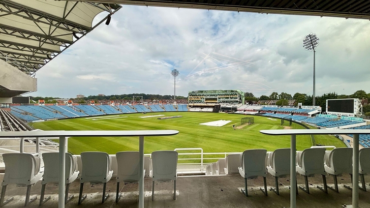 An empty stadium grounds looking out onto the pitch