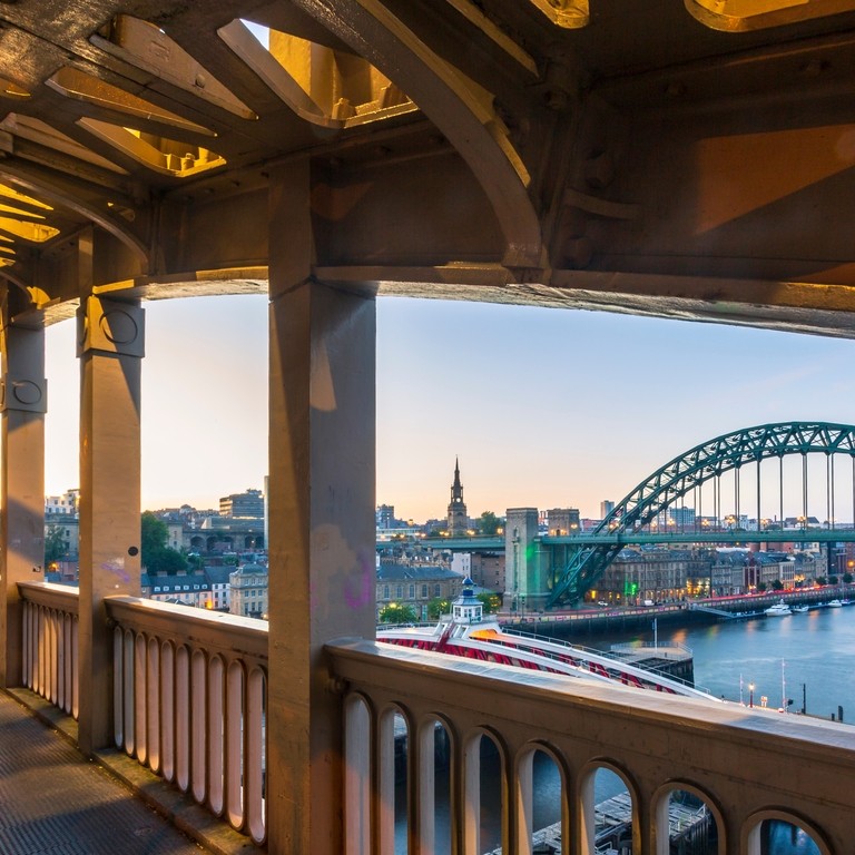 View from pedestrian level of the two bridges connecting Newcastle and Gateshead during a summer evening in June.