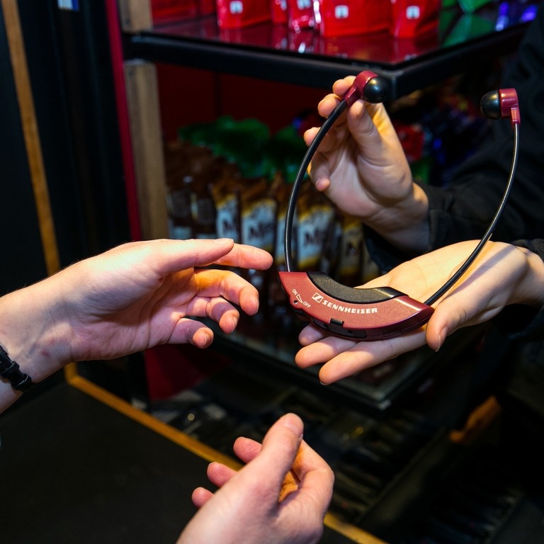 6. Audio Description headset being handed out at Chichester Festival Theatre Photo by Pete Jones 2018