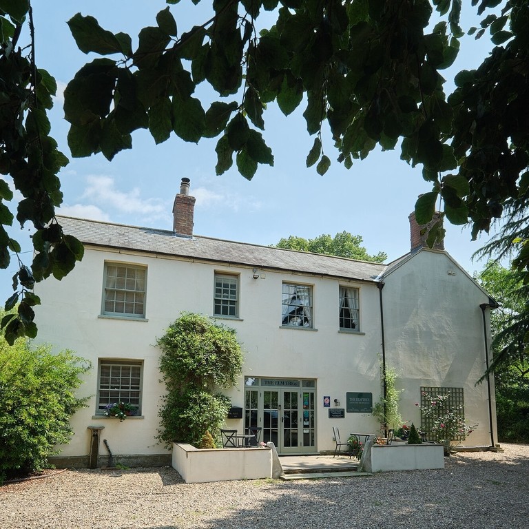 An exterior shot of Elm Tree B&B in the sunshine