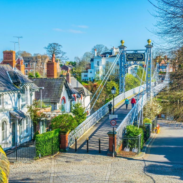 View of residential houses alongside river Dee in Chester, England.