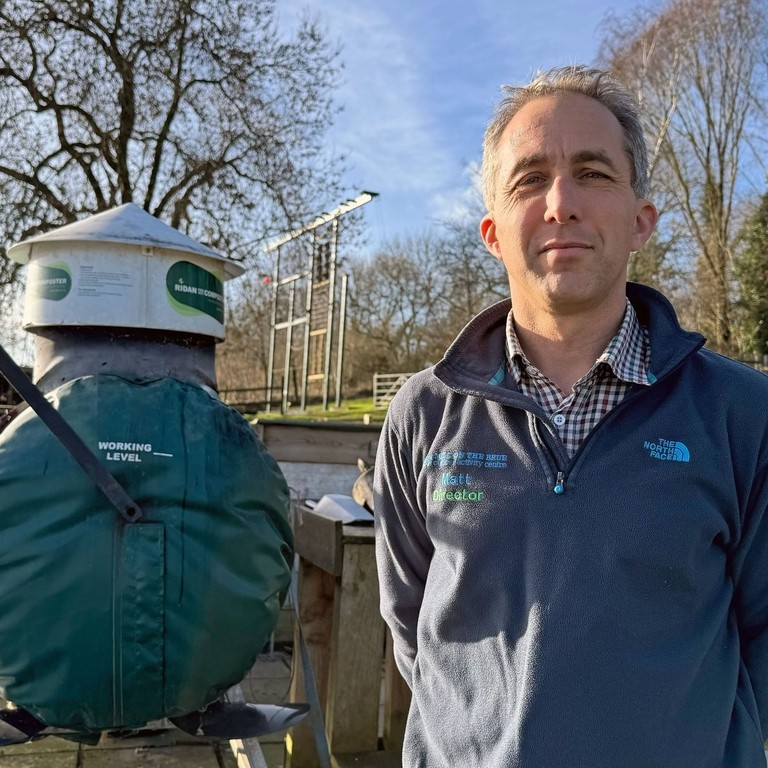 Man standing in an outdoor activity centre