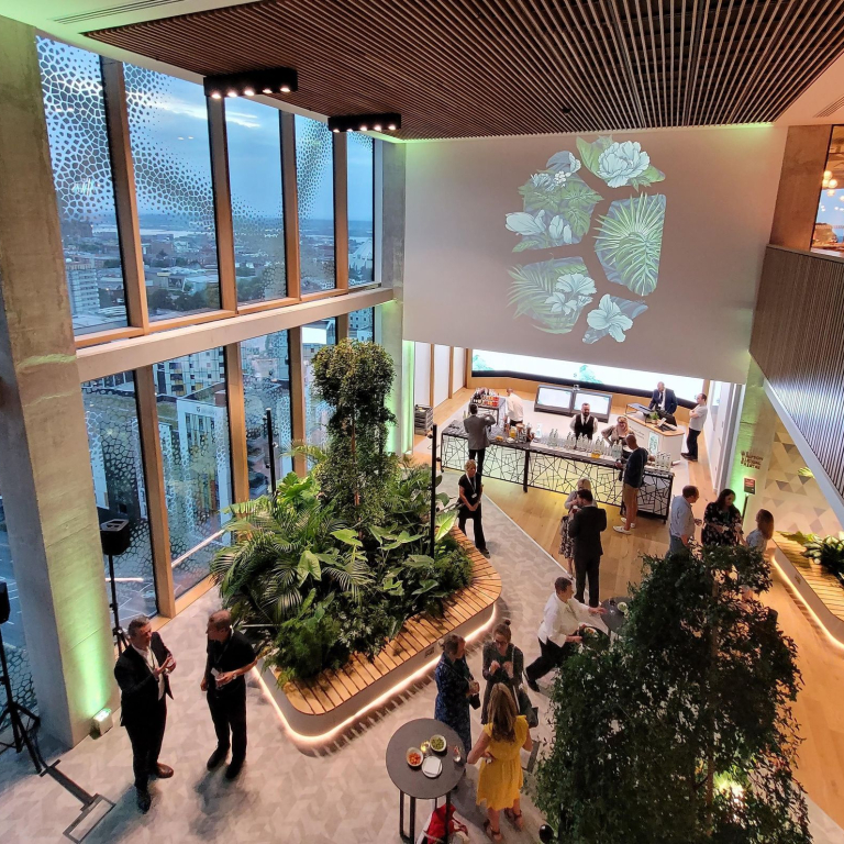 An atrium space at a large event space overlooking city buildings
