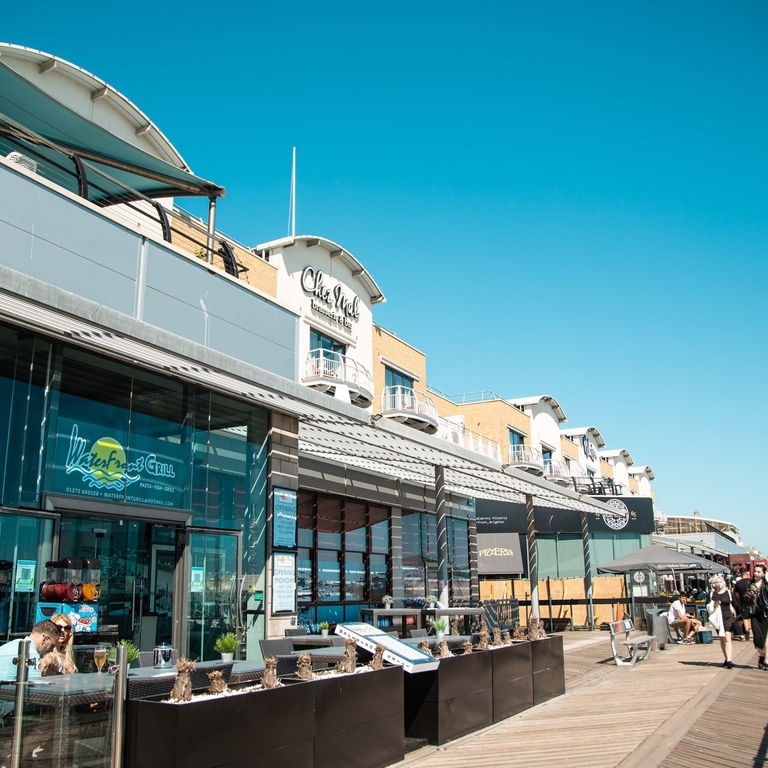 A row of shops and restaurants on Brighton's Marina