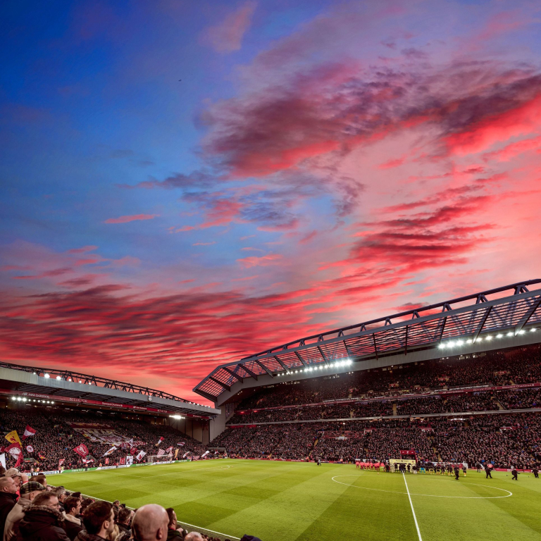 Red clouds in sunset over the ground of a stadium