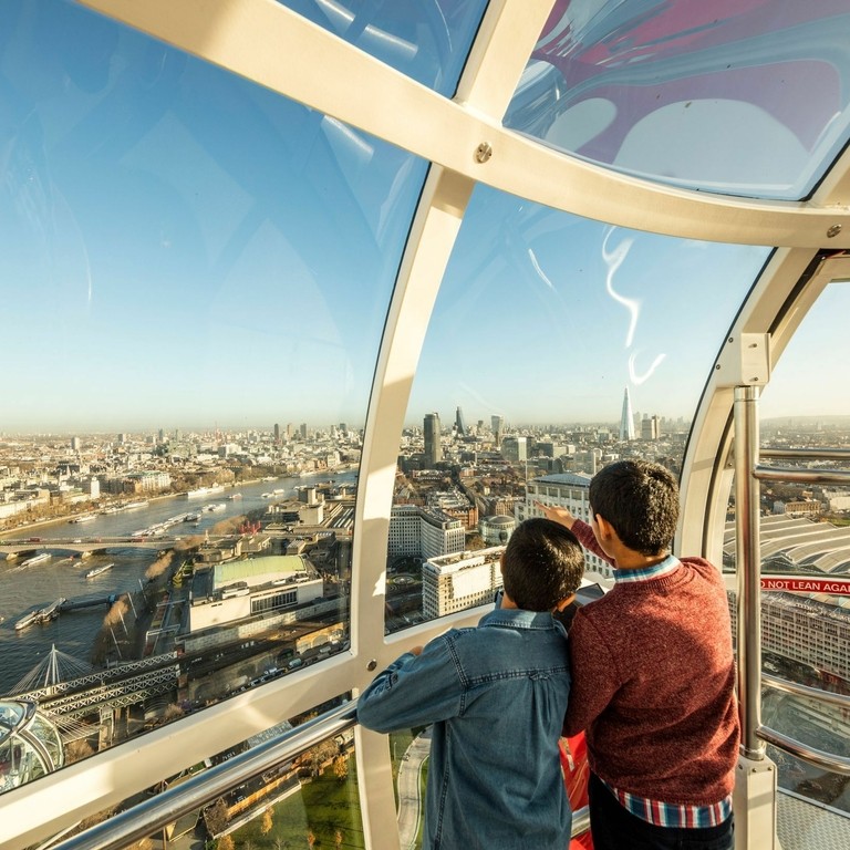 Two boys looking out over the view from a passenger pod
