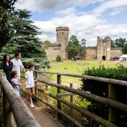 Family walking and exploring the grounds of a castle