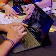 Hands gesture during a meeting at a table at an event