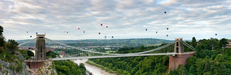 Hot air baloons floating above the Clifton Suspension Bridge in Bristol
