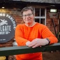 Woman standing near brewery sign at National Forest eBikes