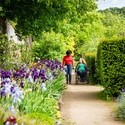 Two women in Helmsley Walled Garden, one using a wheelchair