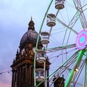 Looking up at Leeds Town Hall and The Observation Wheel at Dusk
